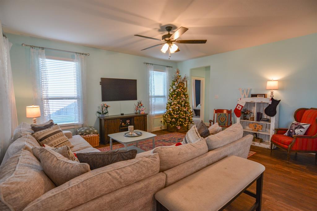 601 Mathew Street Grandview, TX 76050 - Photo 16 of 40 a living room with furniture and a flat screen tv
