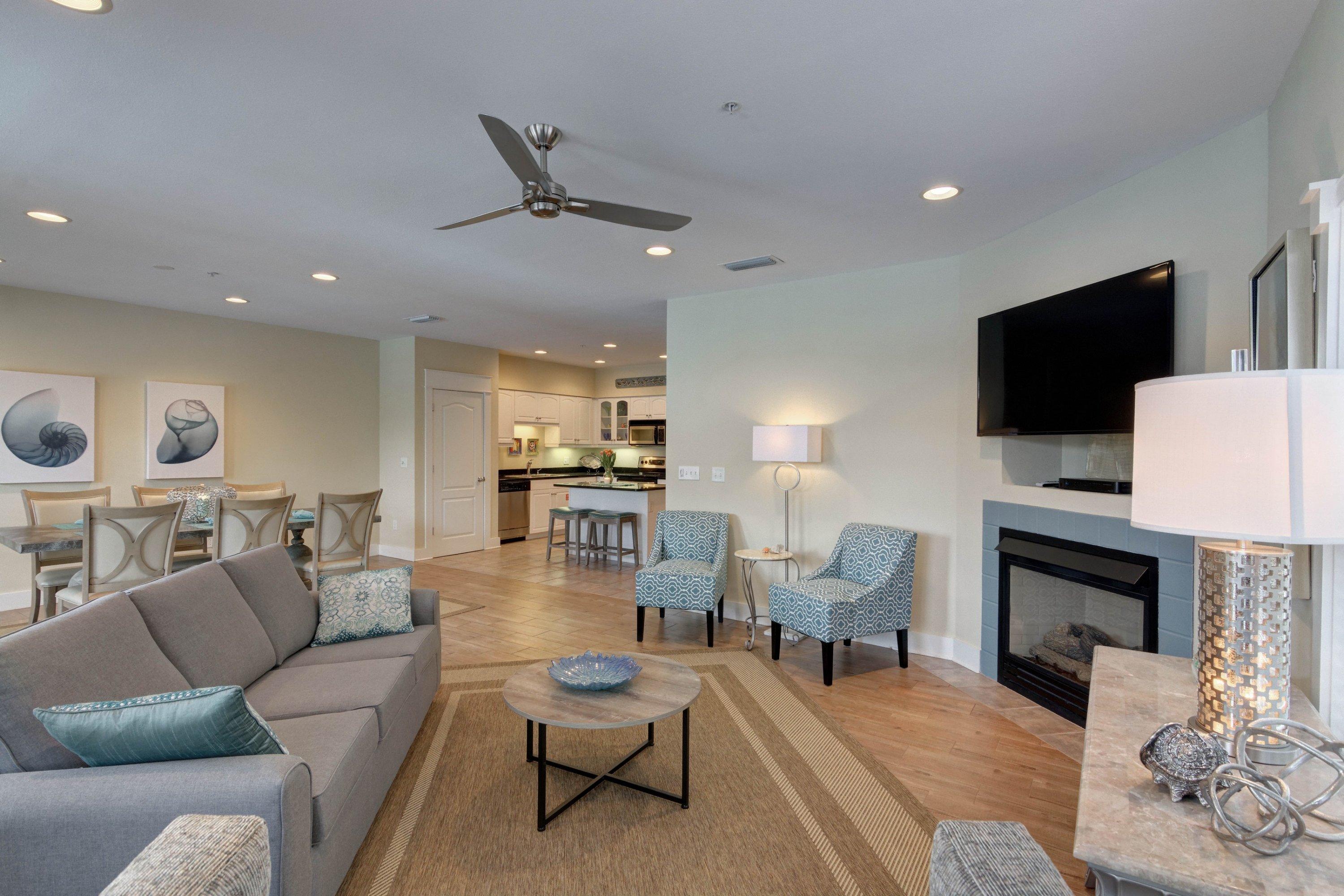 5 Seacrest Blvd Inlet Beach, Unit B201 Inlet Beach, FL 32461 - Photo 20 of 38 a living room with furniture a fireplace and a flat screen tv