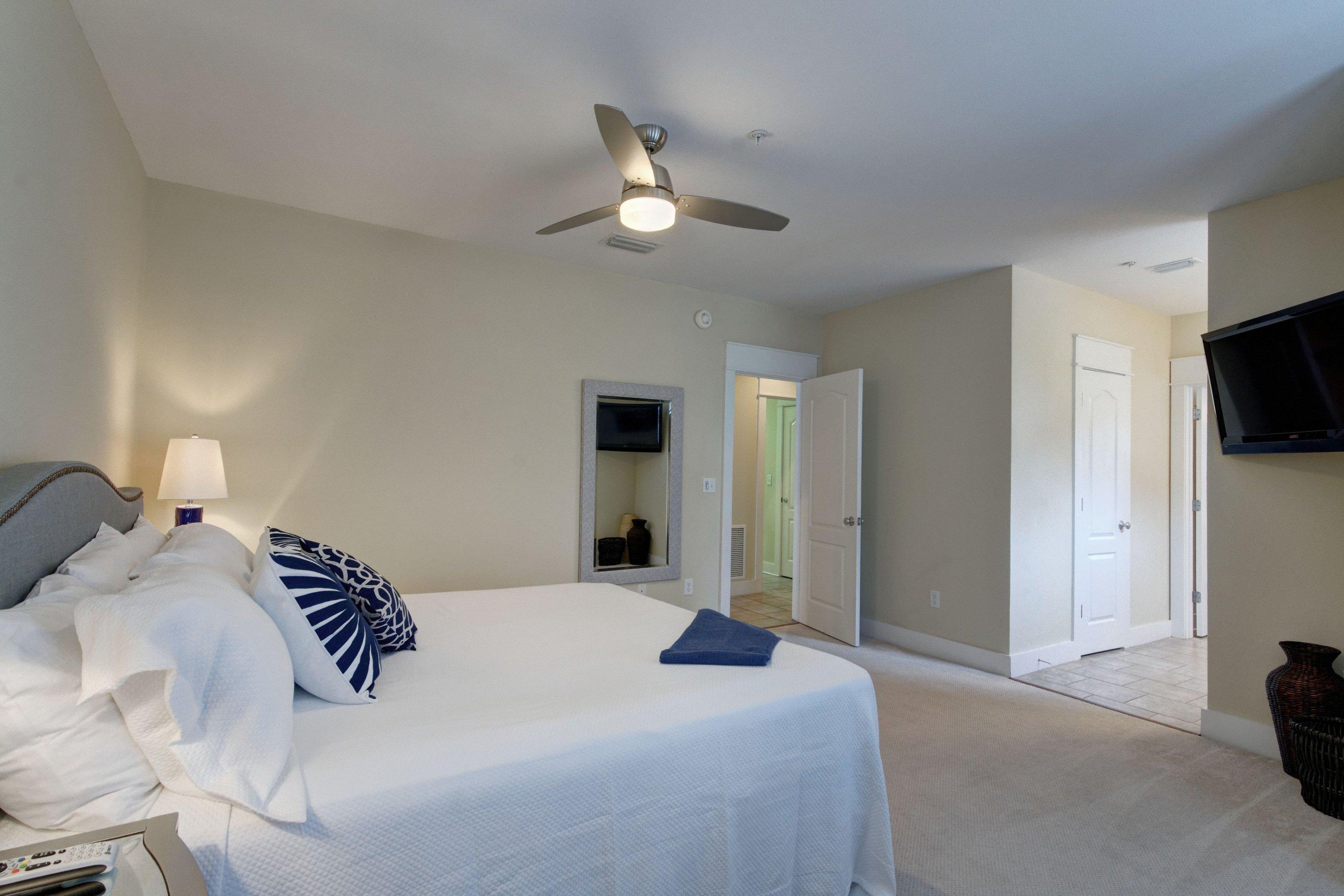 5 Seacrest Blvd Inlet Beach, Unit B201 Inlet Beach, FL 32461 - Photo 24 of 38 a bedroom with a bed and a chandelier