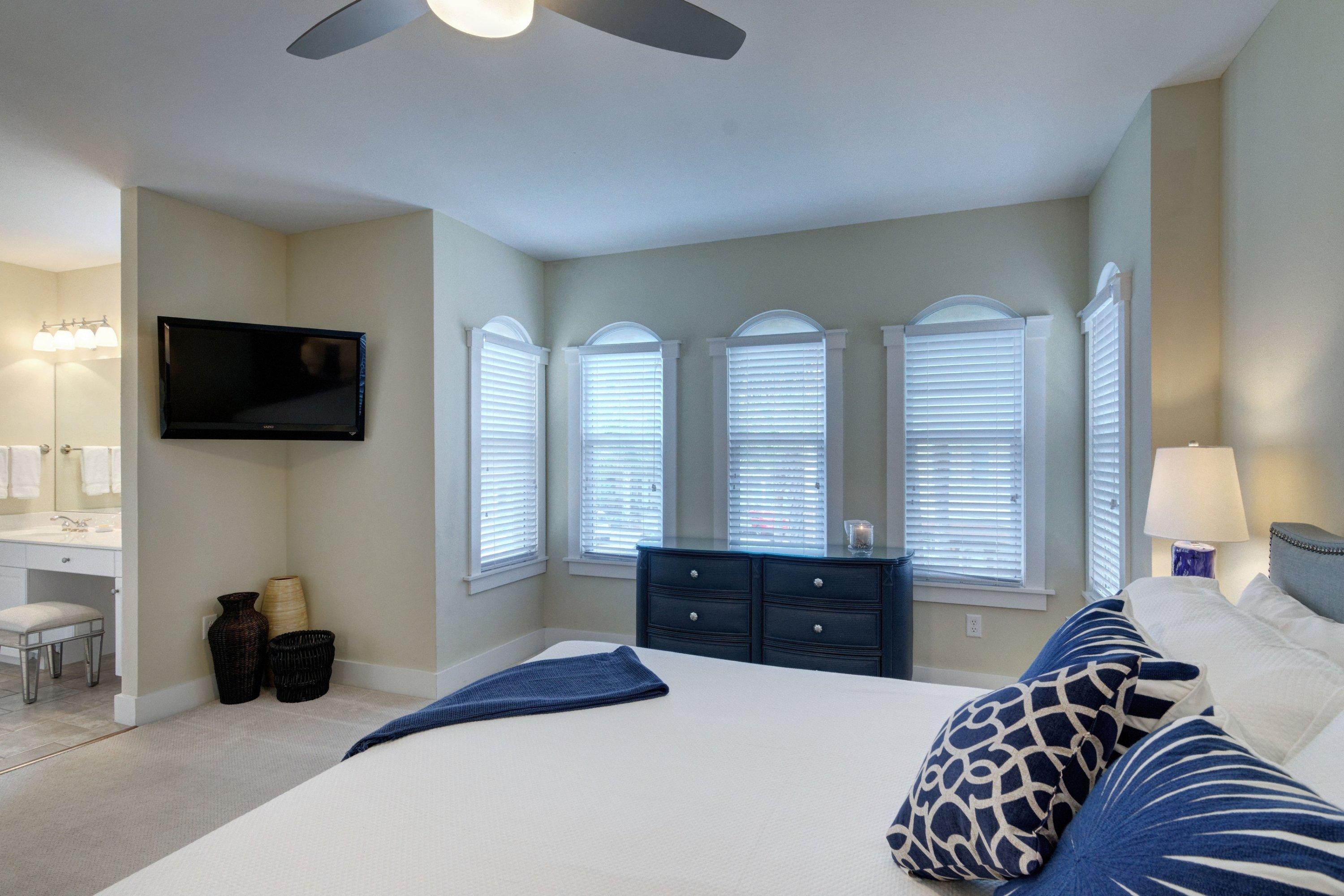 5 Seacrest Blvd Inlet Beach, Unit B201 Inlet Beach, FL 32461 - Photo 25 of 38 a bedroom with a bed and a flat screen television