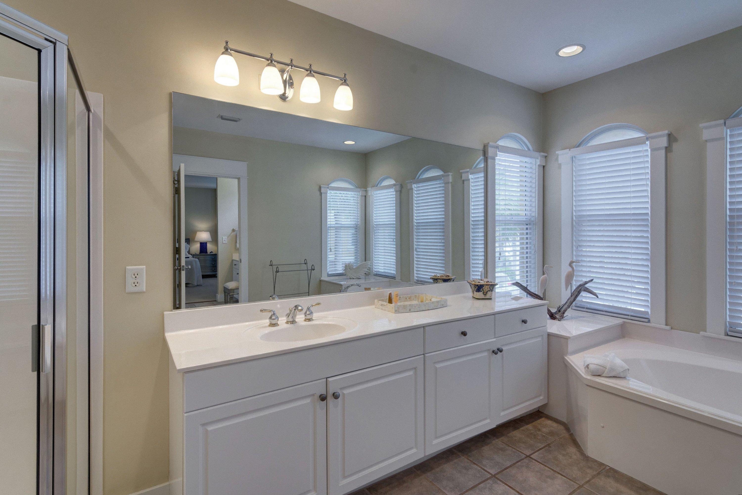 5 Seacrest Blvd Inlet Beach, Unit B201 Inlet Beach, FL 32461 - Photo 29 of 38 a bathroom with a double vanity sink large mirror and a bathtub