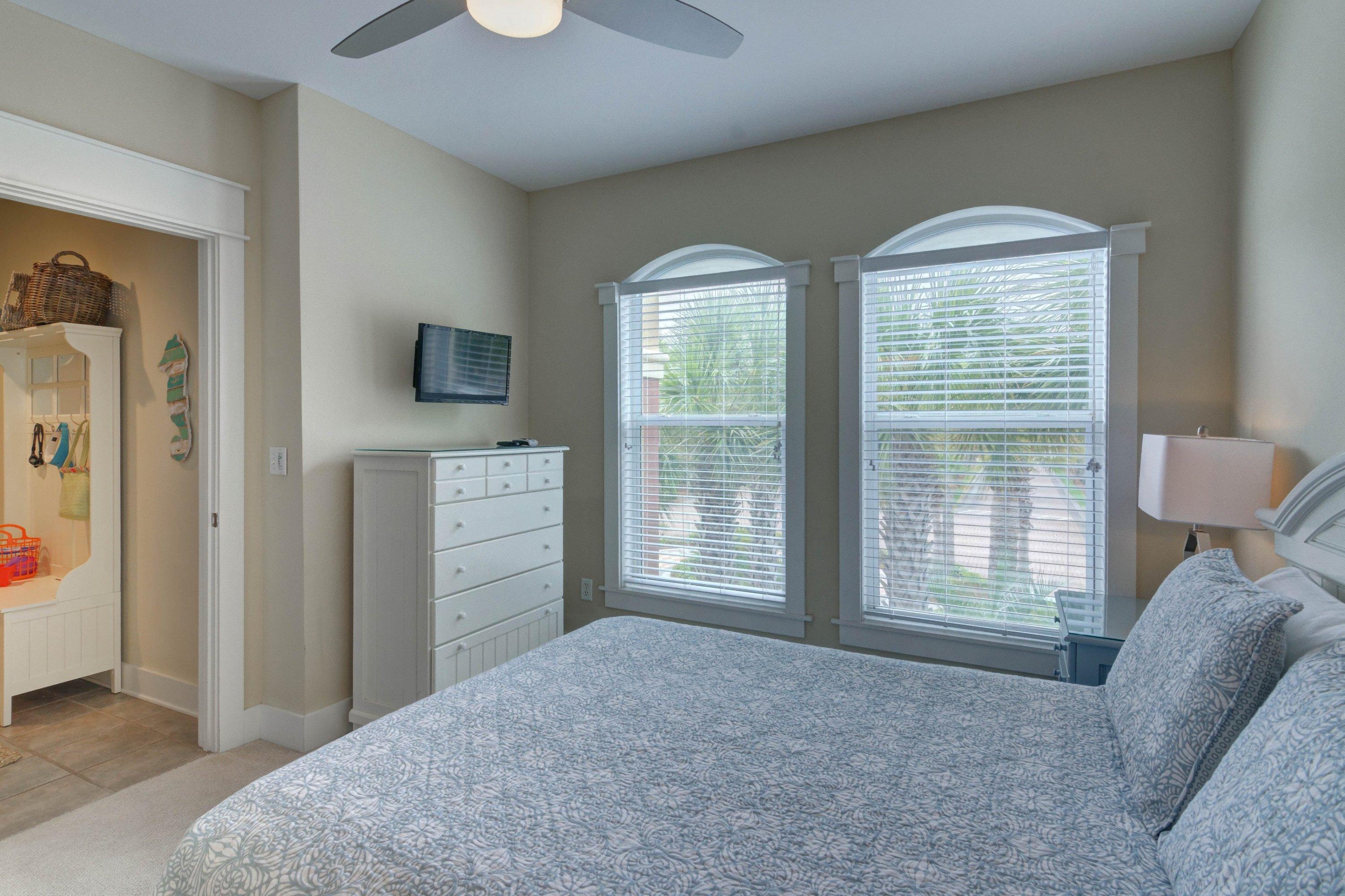 5 Seacrest Blvd Inlet Beach, Unit B201 Inlet Beach, FL 32461 - Photo 32 of 38 a bedroom with a bed and a television