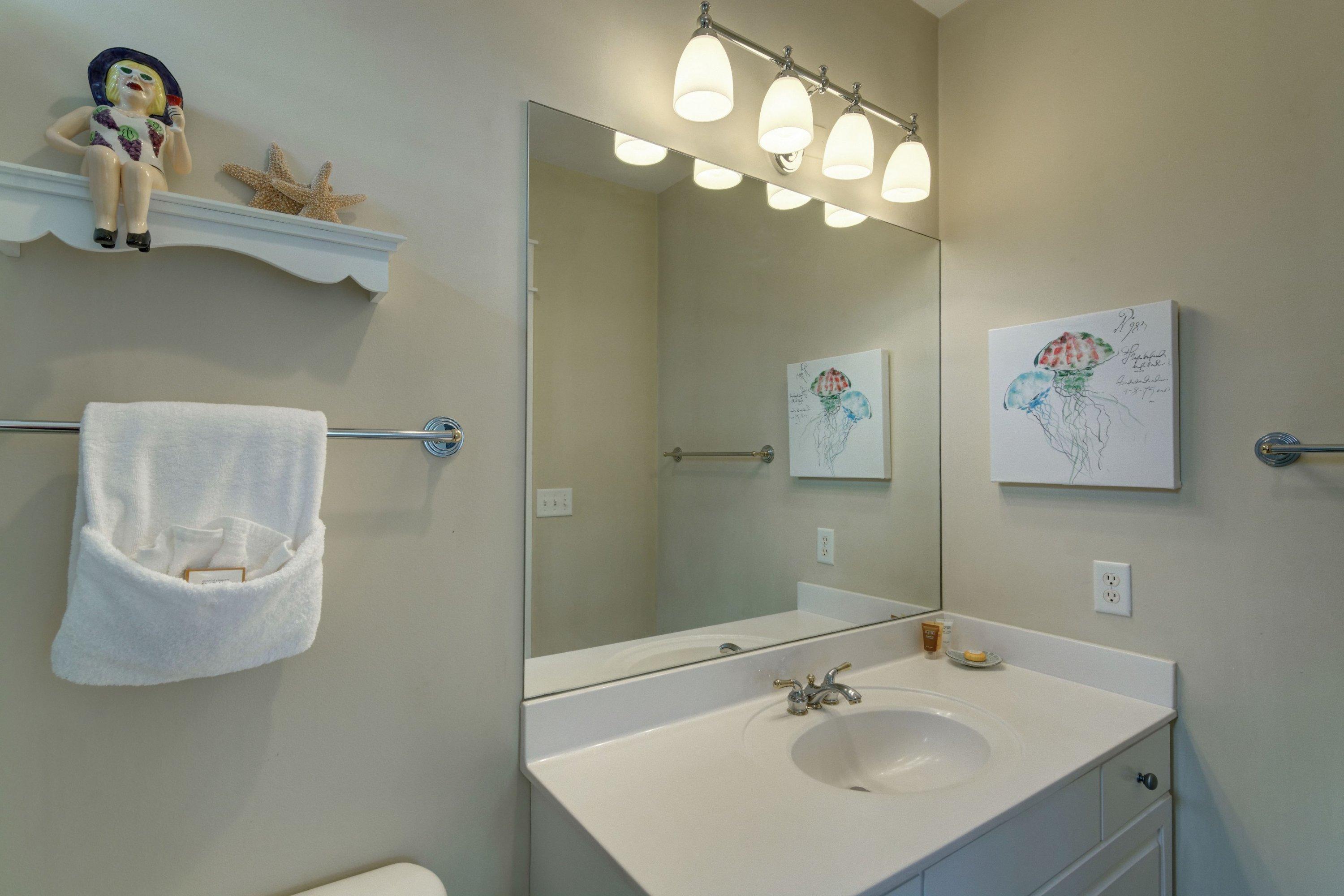 5 Seacrest Blvd Inlet Beach, Unit B201 Inlet Beach, FL 32461 - Photo 33 of 38 a bathroom with a sink and a mirror
