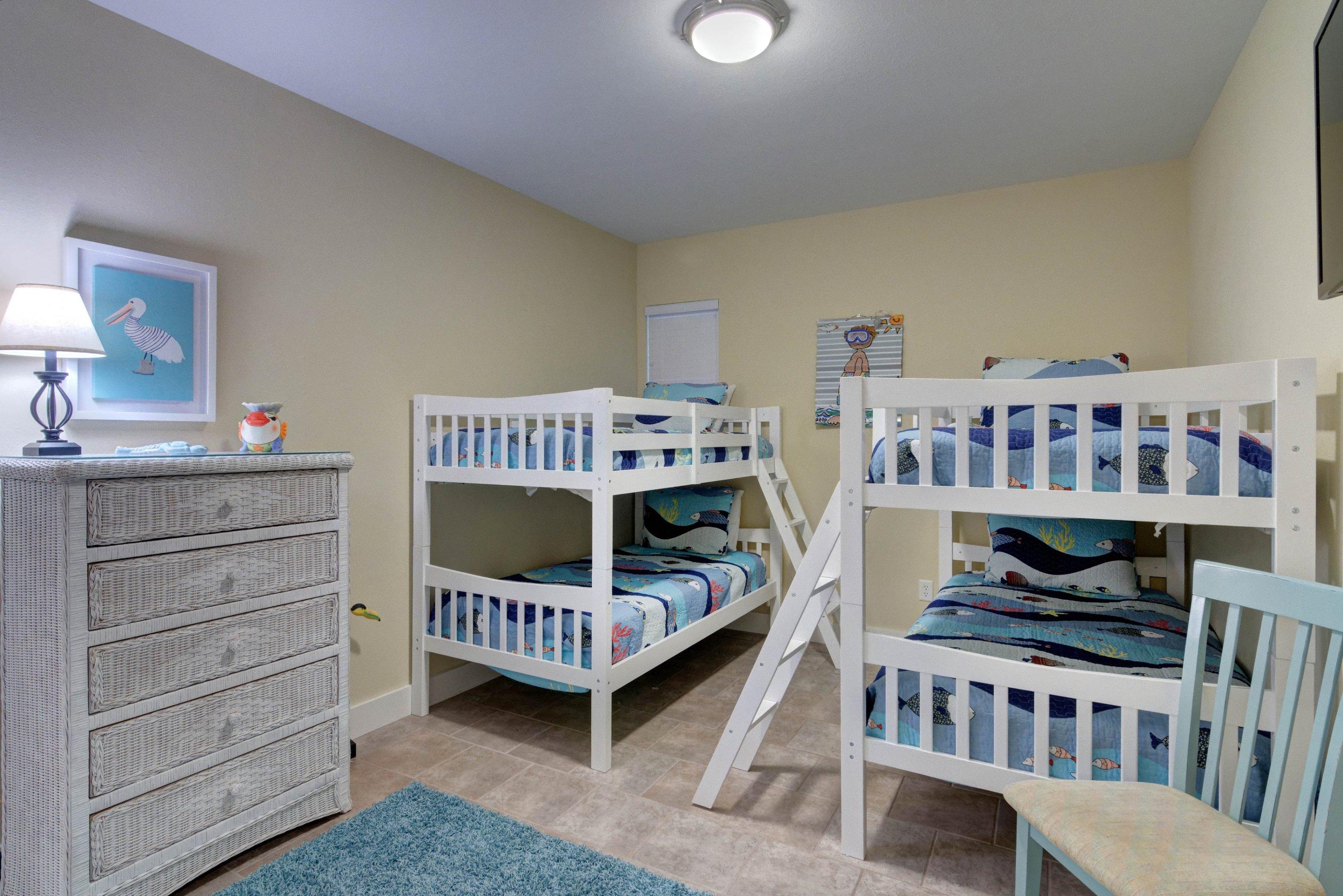 5 Seacrest Blvd Inlet Beach, Unit B201 Inlet Beach, FL 32461 - Photo 35 of 38 a bedroom with furniture and a baby crib