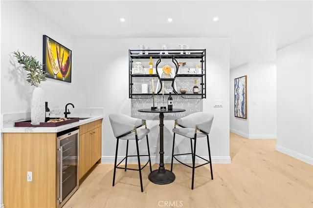 a kitchen with stainless steel appliances a stove a sink and a refrigerator