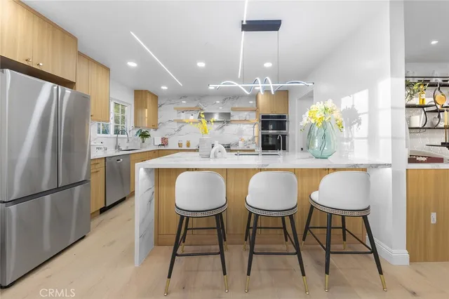 a kitchen with granite countertop counter space and stainless steel appliances