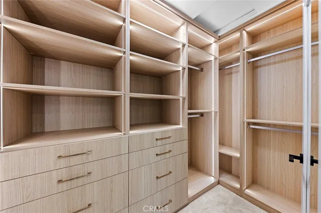 a bedroom with a bed and a potted plant