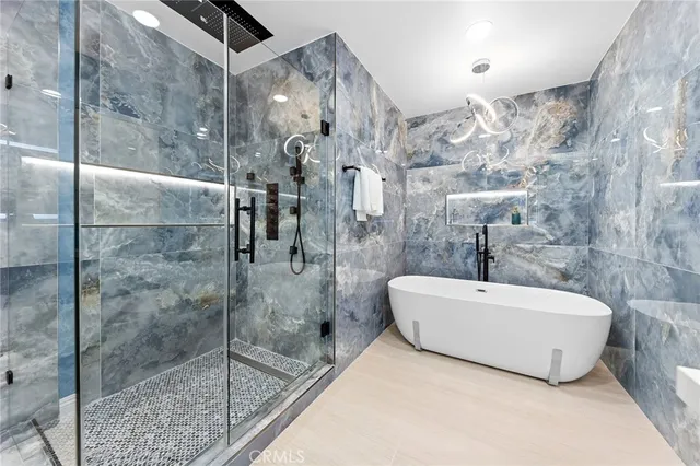a bathroom with a sink vanity mirror and toilet