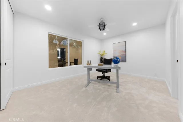 a bedroom with bed and a window