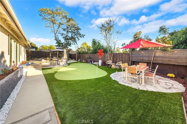a view of swimming pool with outdoor seating