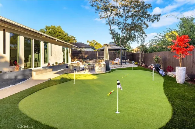a table and chairs in a garden