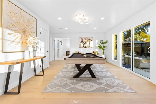a living room with furniture a rug and a large window