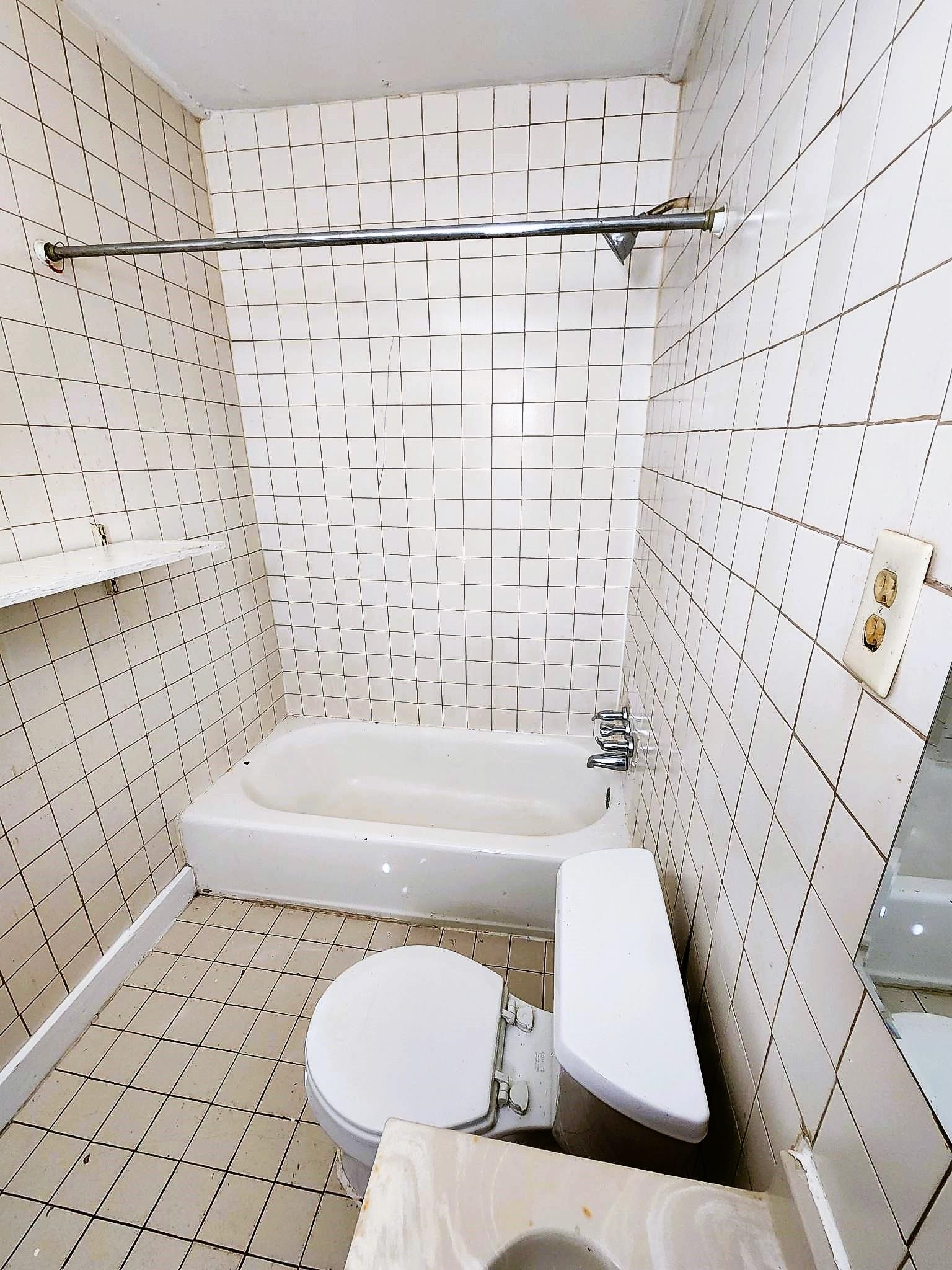 3255 Macon Road Memphis, TN 38122 - Photo 2 of 2 a bathroom with a bathtub and shower