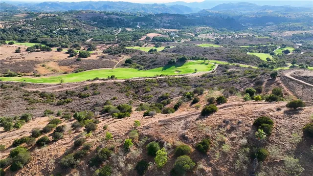 a view of a city with green field