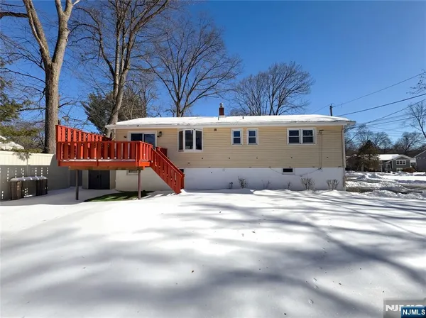 a view of a house with a snow in a yard