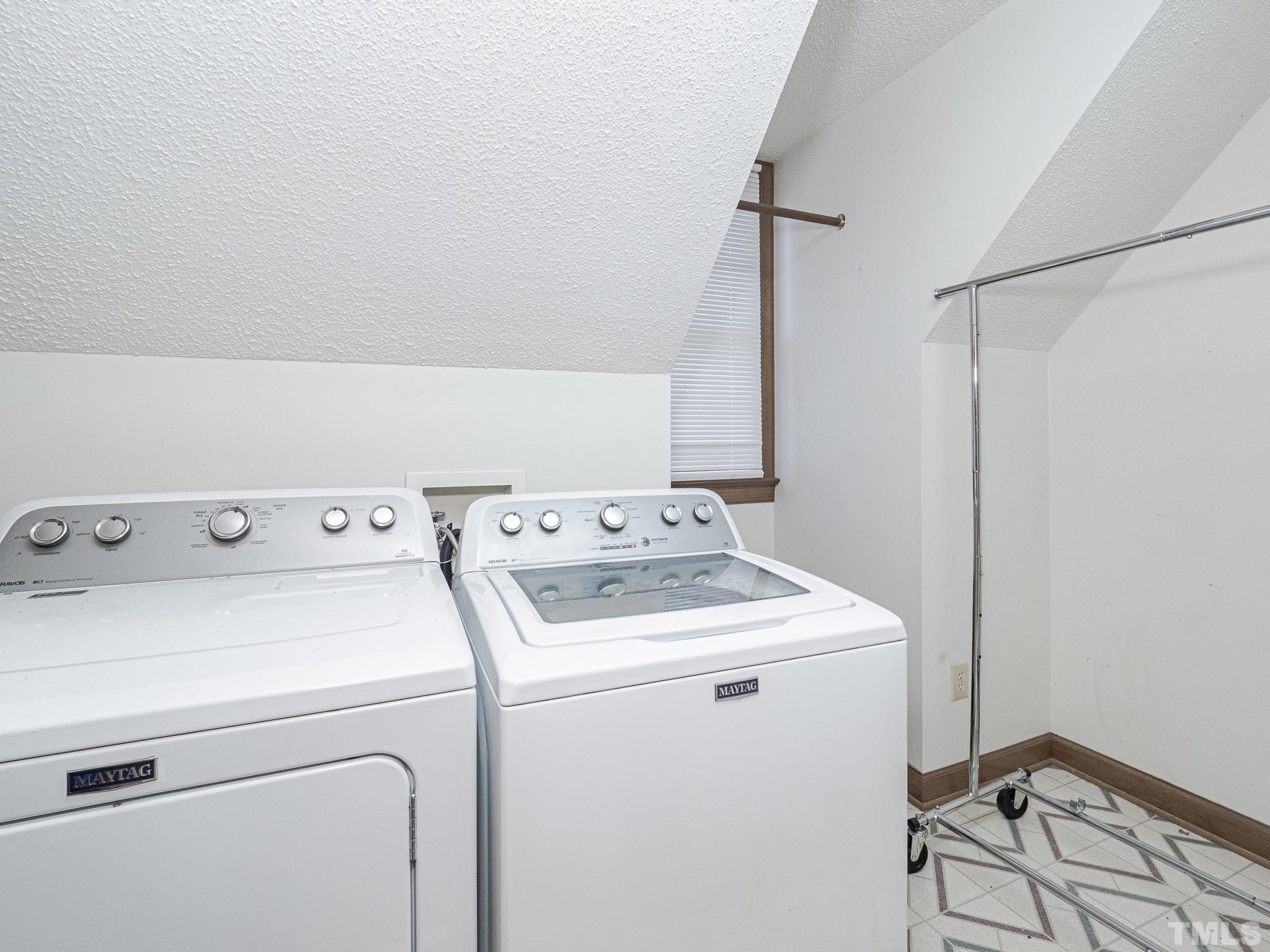8001 Falling Leaf Court Raleigh, NC 27615 - Photo 22 of 32 a utility room with dryer and washer