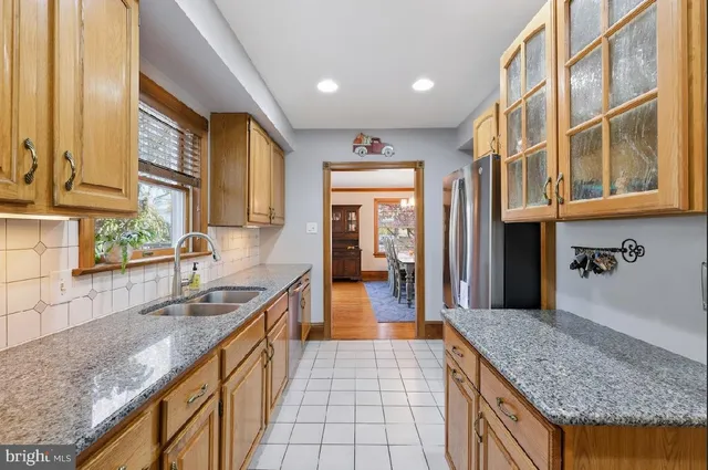 a bathroom with a sink a toilet and a shower