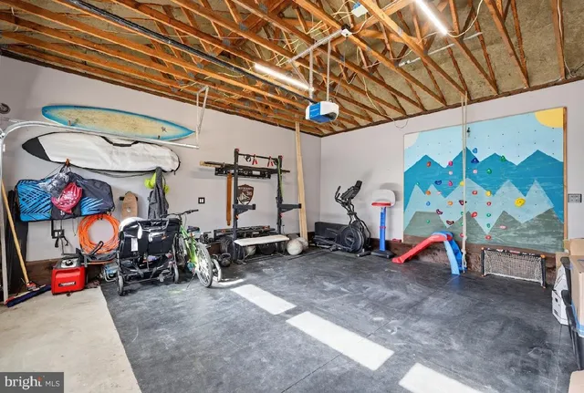 a view of a roof deck with table and chairs a barbeque with wooden floor and fence