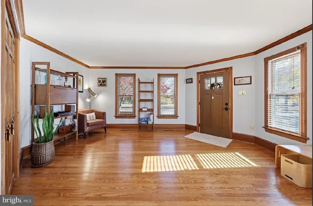 a bedroom with furniture and a wooden floor