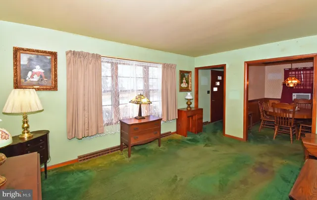 a bed room with furniture and a window