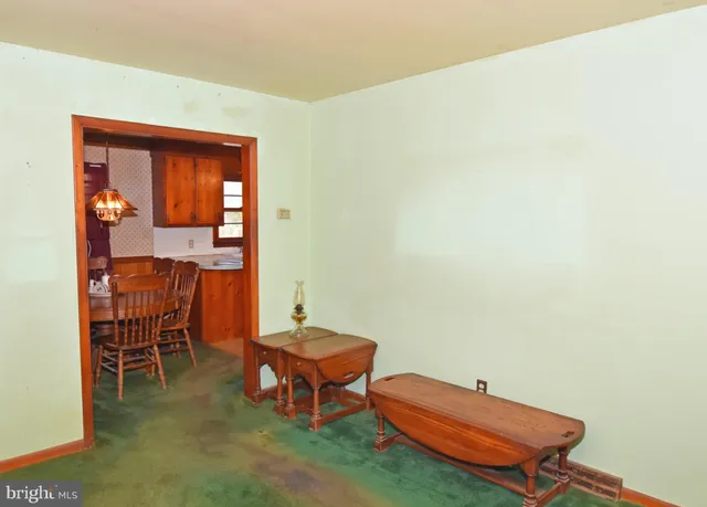 a room with chairs and table