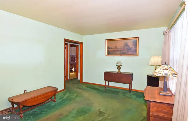 a bedroom with furniture and a lounge chair