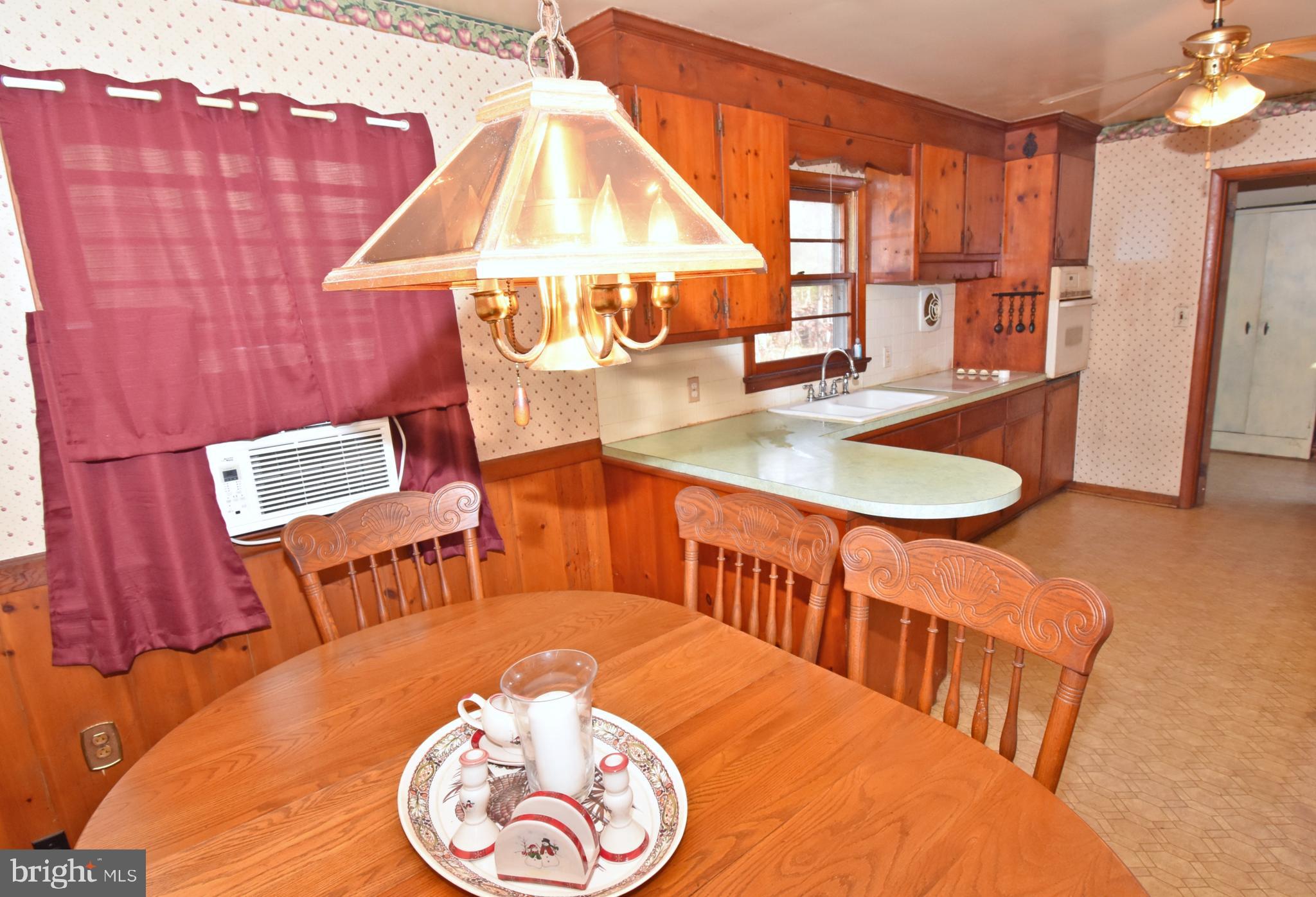 4301 Tyaskin Road Tyaskin, MD 21865 - Photo 5 of 43 a dining room with furniture and a wooden floor