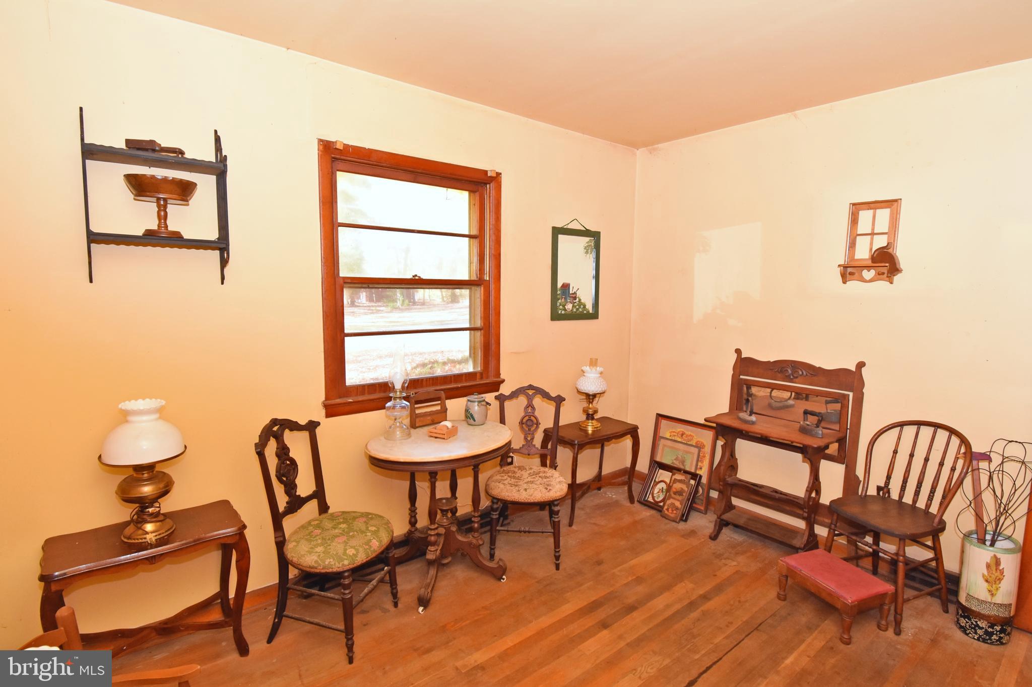 4301 Tyaskin Road Tyaskin, MD 21865 - Photo 10 of 43 a view of a dining room with furniture and wooden floor