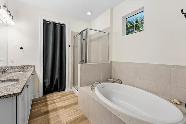 a bathroom with a bathtub and a sink