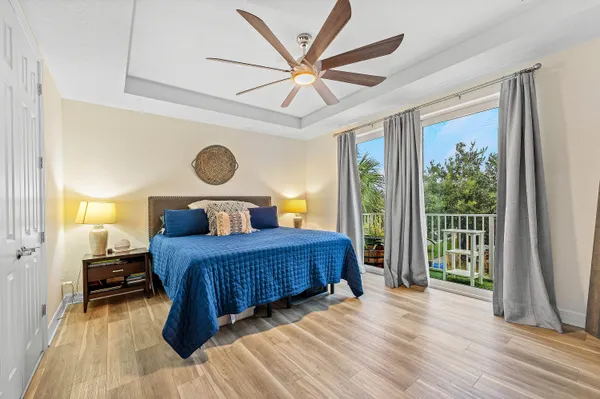 a bedroom with a large bed and a large window