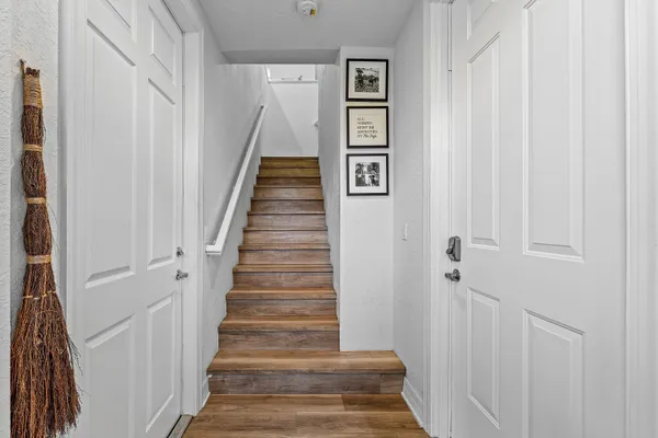 a view of a hallway with stairs