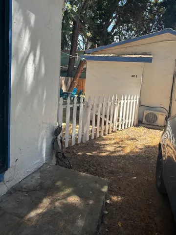 a view of a tree with a yard