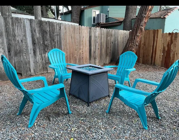 a view of a chairs in a backyard