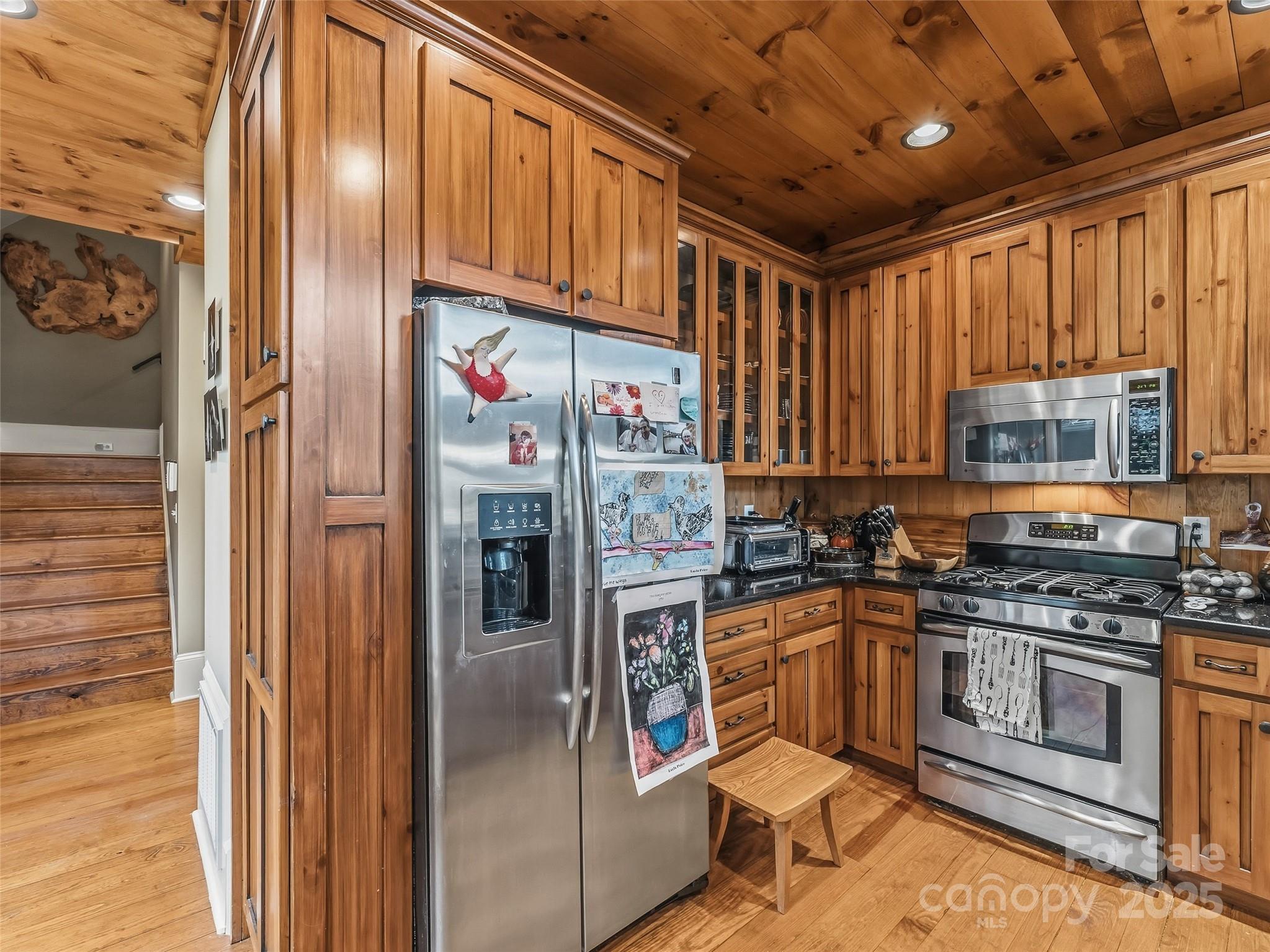 129 Ivy Ridge, Unit I26 Lake Toxaway, NC 28747 - Photo 13 of 39 a kitchen with stainless steel appliances granite countertop a refrigerator a stove and a sink with dishwasher