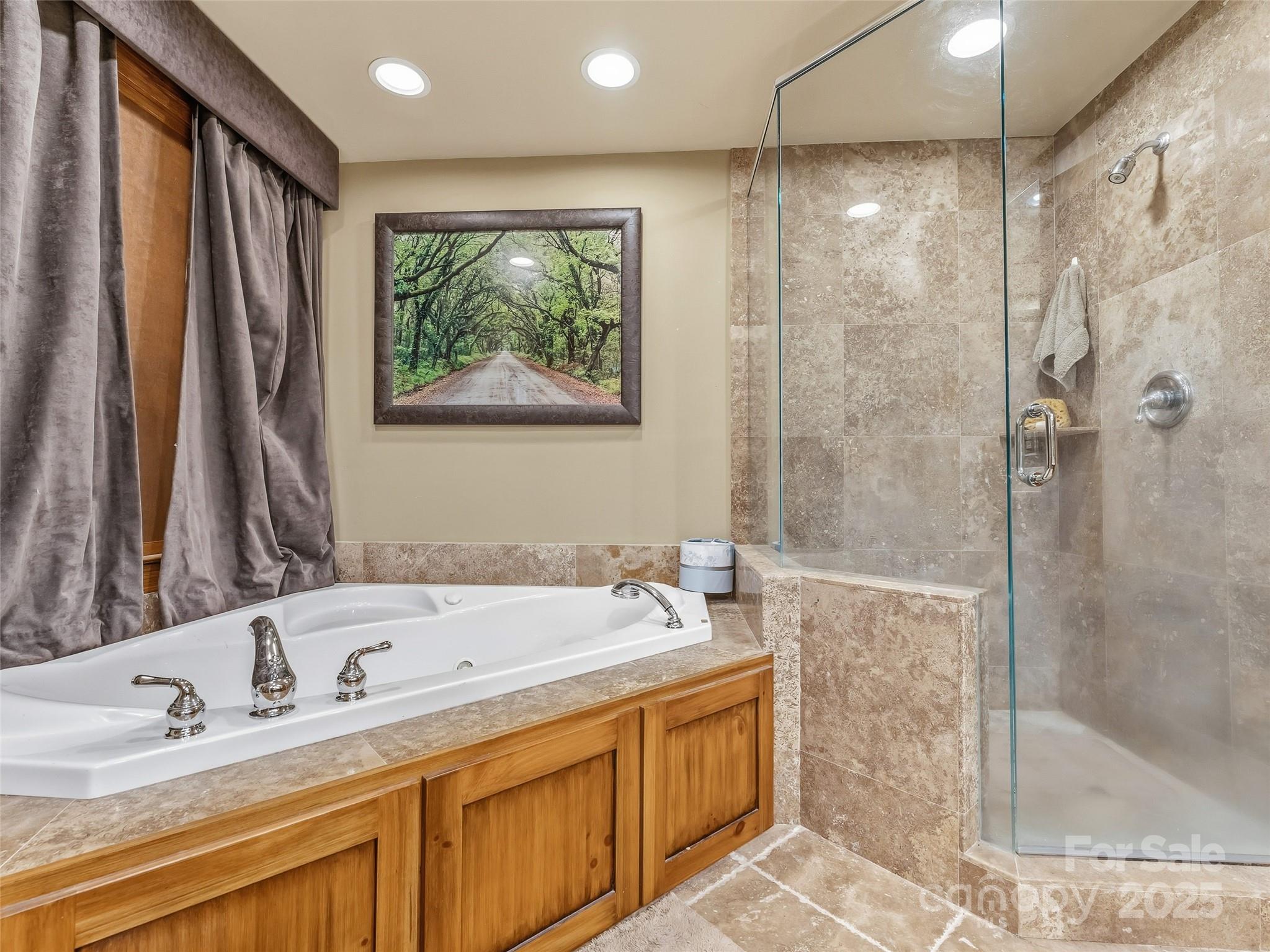 129 Ivy Ridge, Unit I26 Lake Toxaway, NC 28747 - Photo 16 of 39 a bathroom with a tub sink and mirror