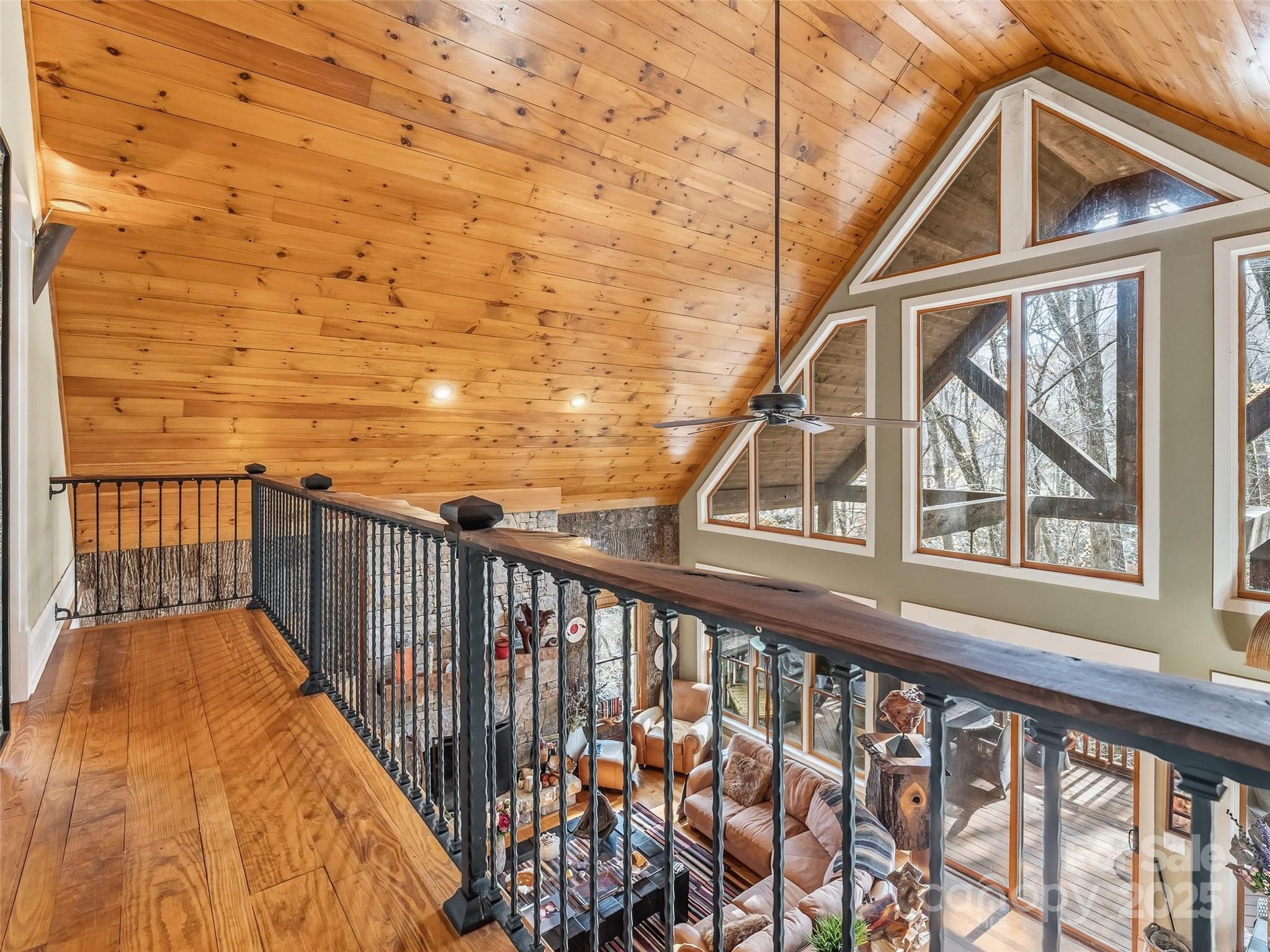 129 Ivy Ridge, Unit I26 Lake Toxaway, NC 28747 - Photo 23 of 39 a view of a balcony with wooden floor and fence