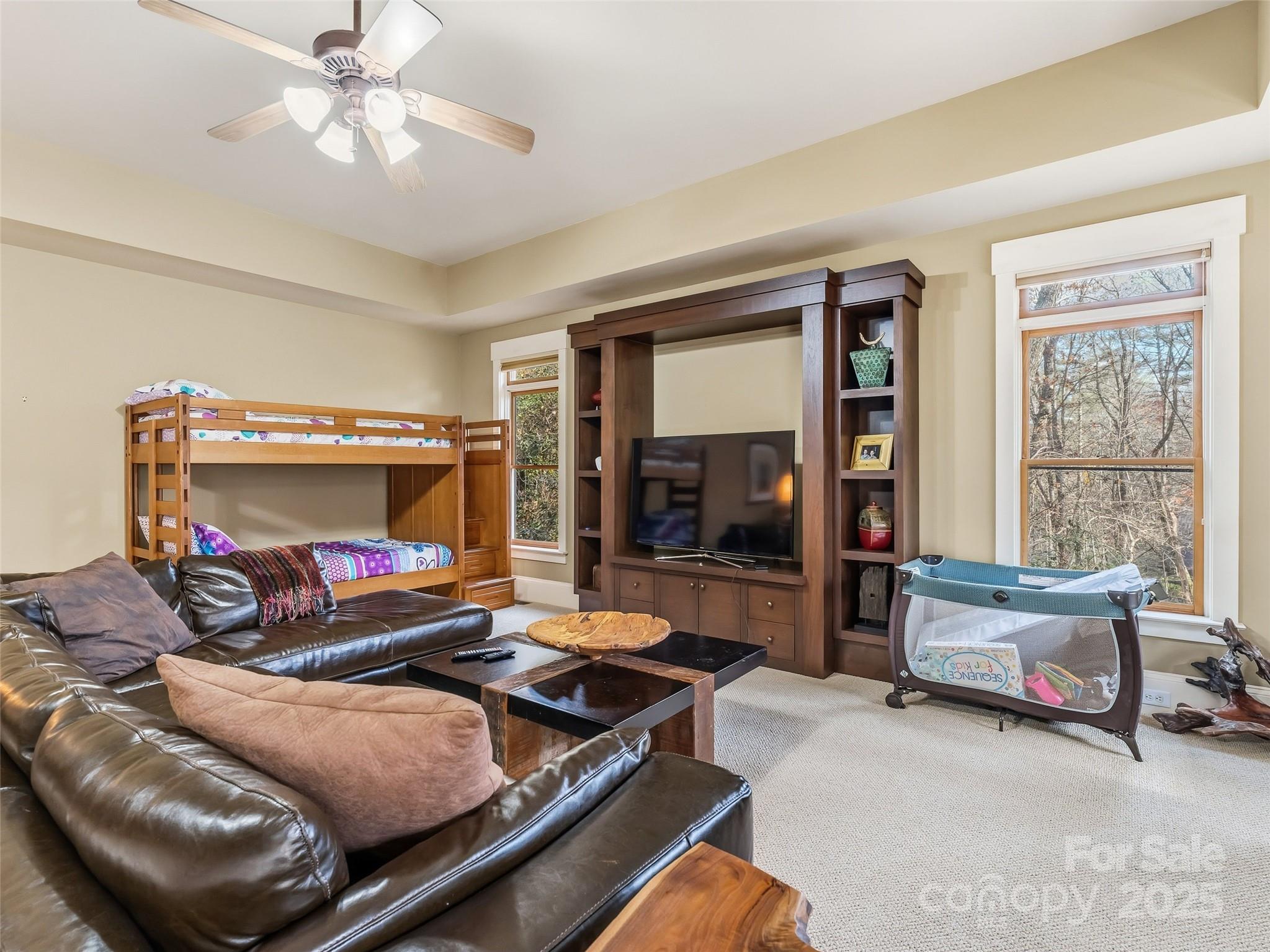 129 Ivy Ridge, Unit I26 Lake Toxaway, NC 28747 - Photo 28 of 39 a bedroom with furniture and a large window