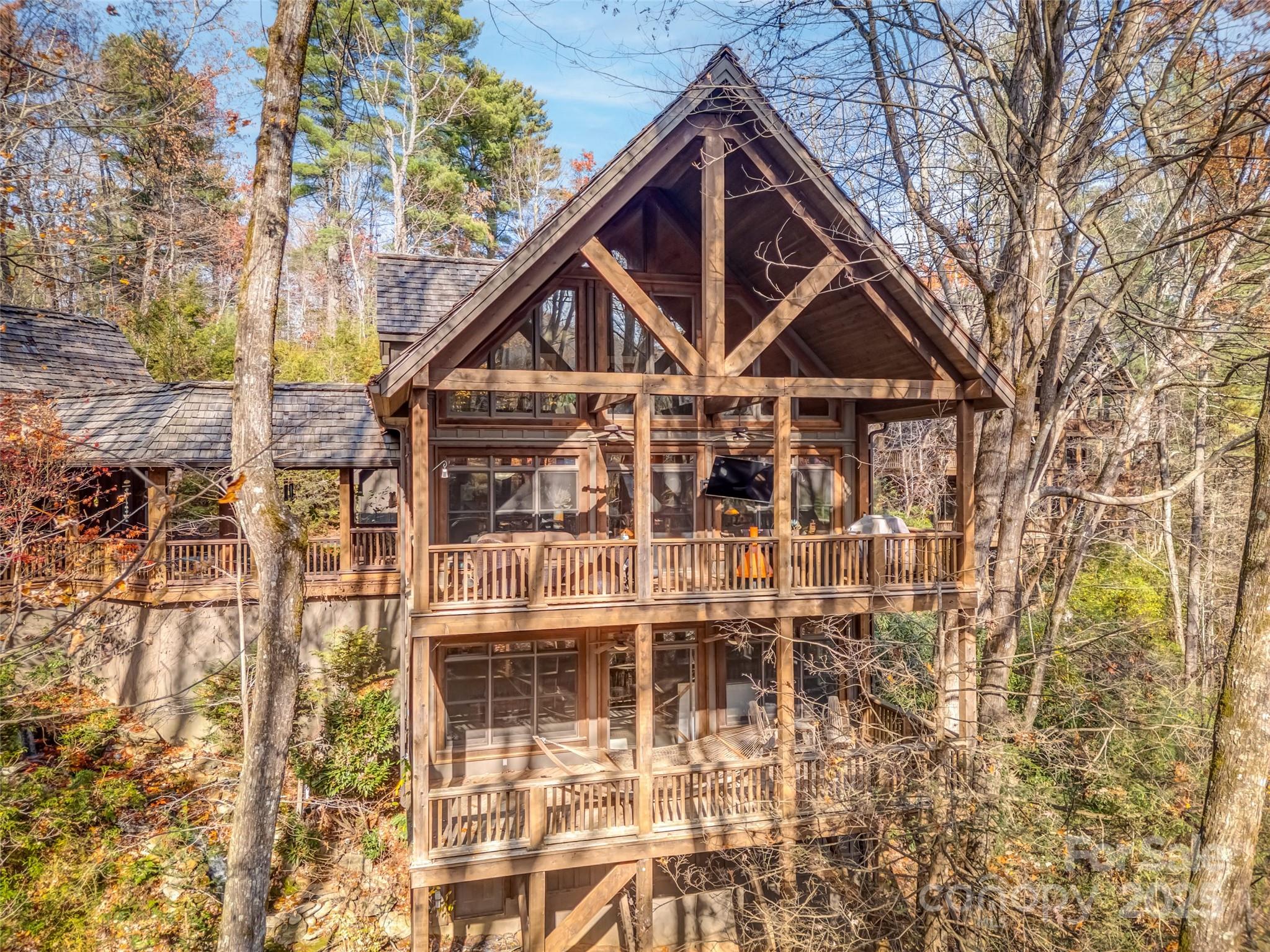 129 Ivy Ridge, Unit I26 Lake Toxaway, NC 28747 - Photo 35 of 39 a front view of a house with a yard