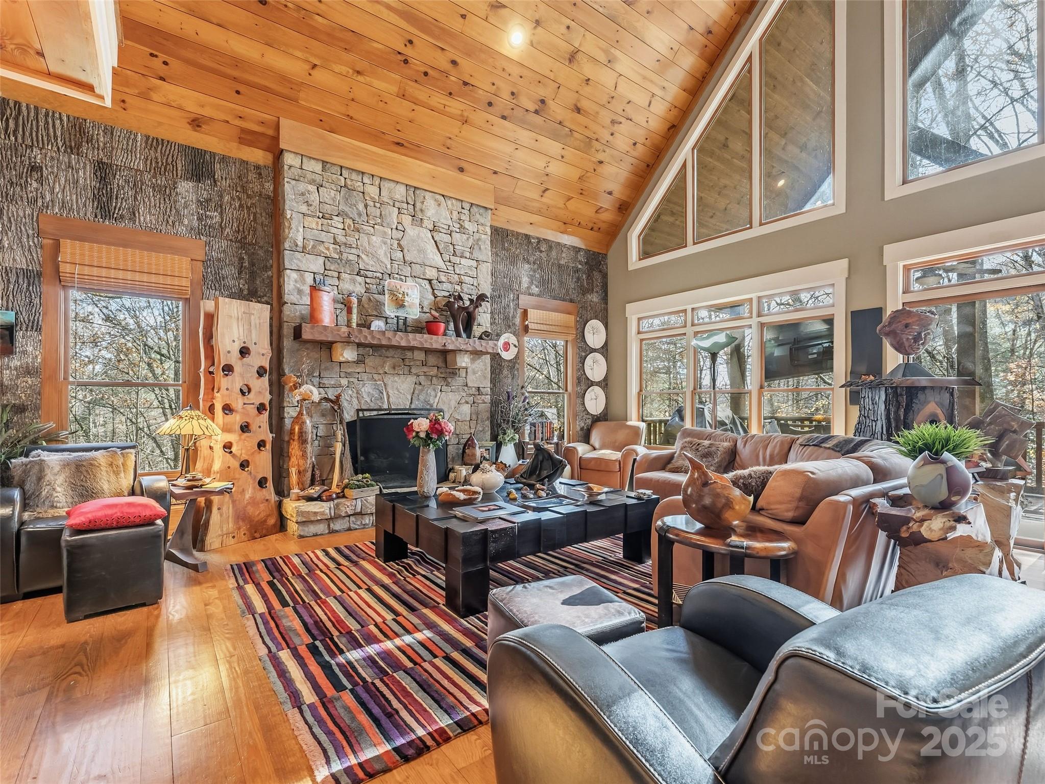 129 Ivy Ridge, Unit I26 Lake Toxaway, NC 28747 - Photo 4 of 39 a living room with furniture fireplace and a large window
