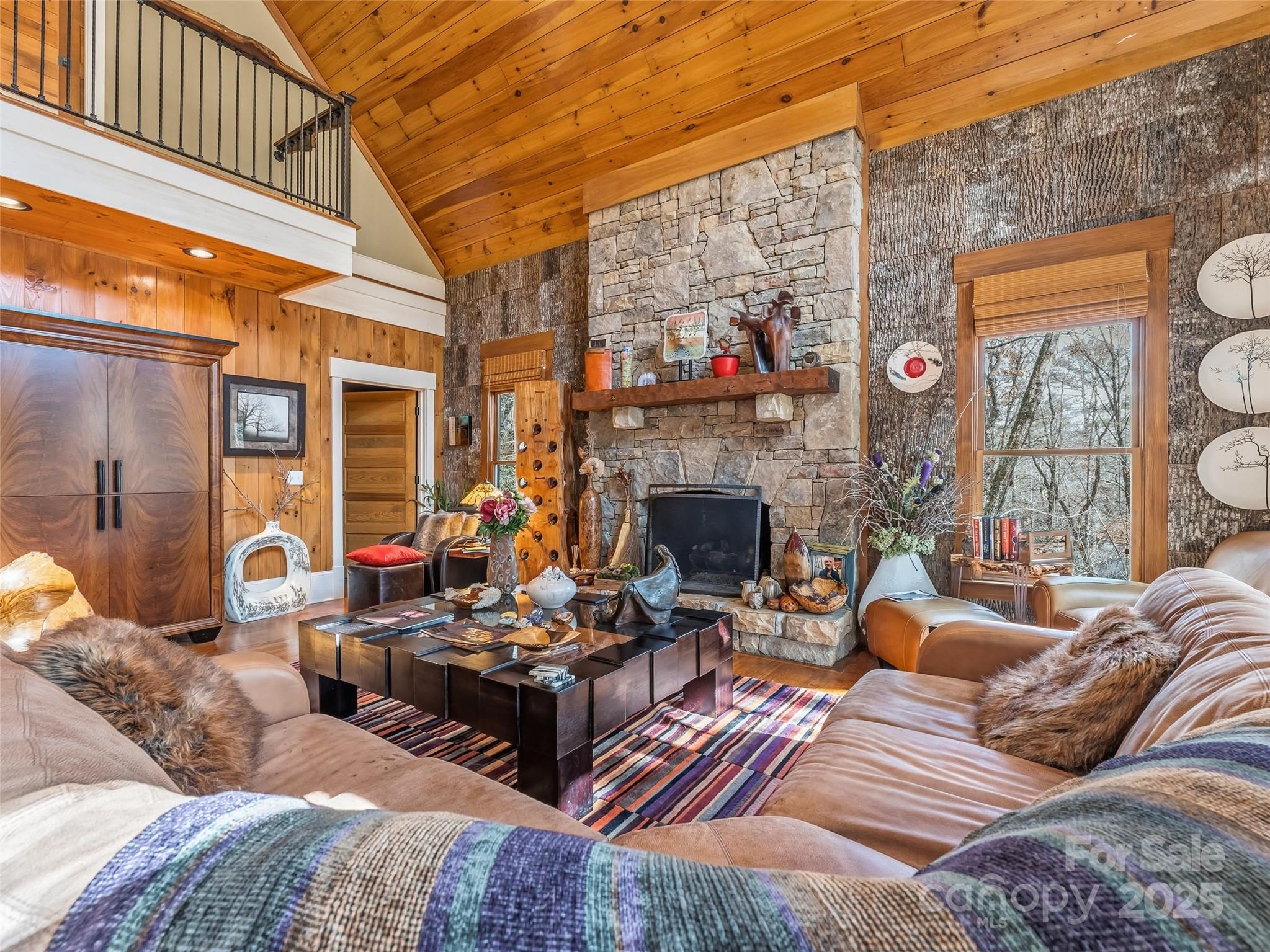 129 Ivy Ridge, Unit I26 Lake Toxaway, NC 28747 - Photo 7 of 39 a living room with furniture a fireplace and a flat screen tv