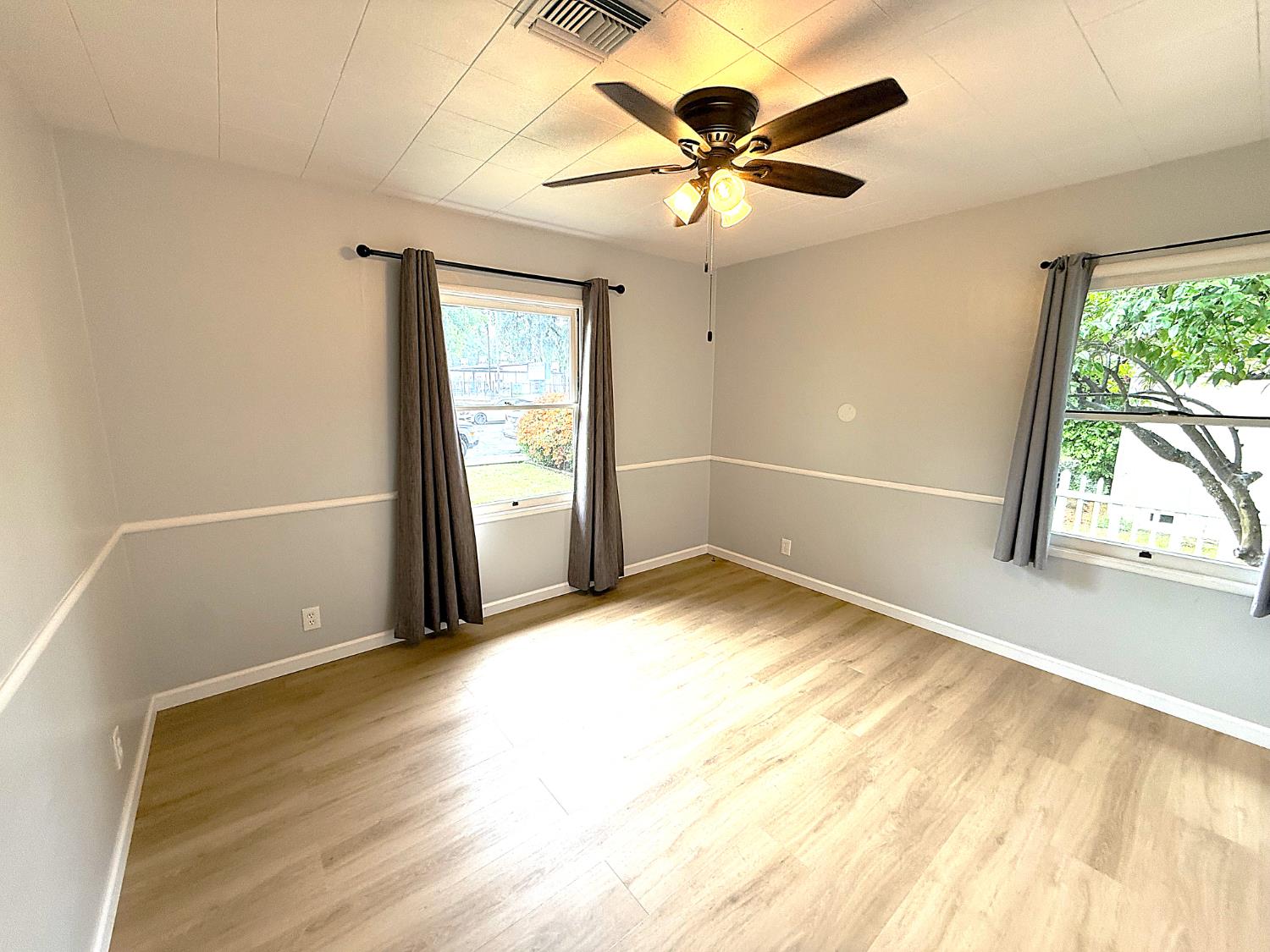 809 South Sowell Street Visalia, CA 93277 - Photo 25 of 58 wooden floor in an empty room with a window