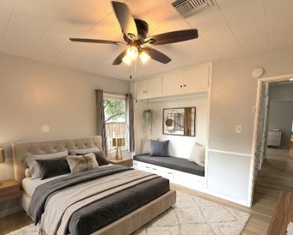 809 South Sowell Street Visalia, CA 93277 - Photo 27 of 58 a bedroom with a large bed and a ceiling fan