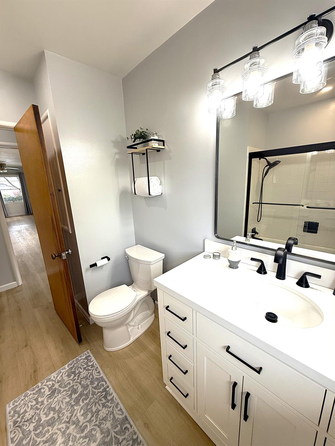 809 South Sowell Street Visalia, CA 93277 - Photo 29 of 58 a bathroom with a sink toilet and mirror