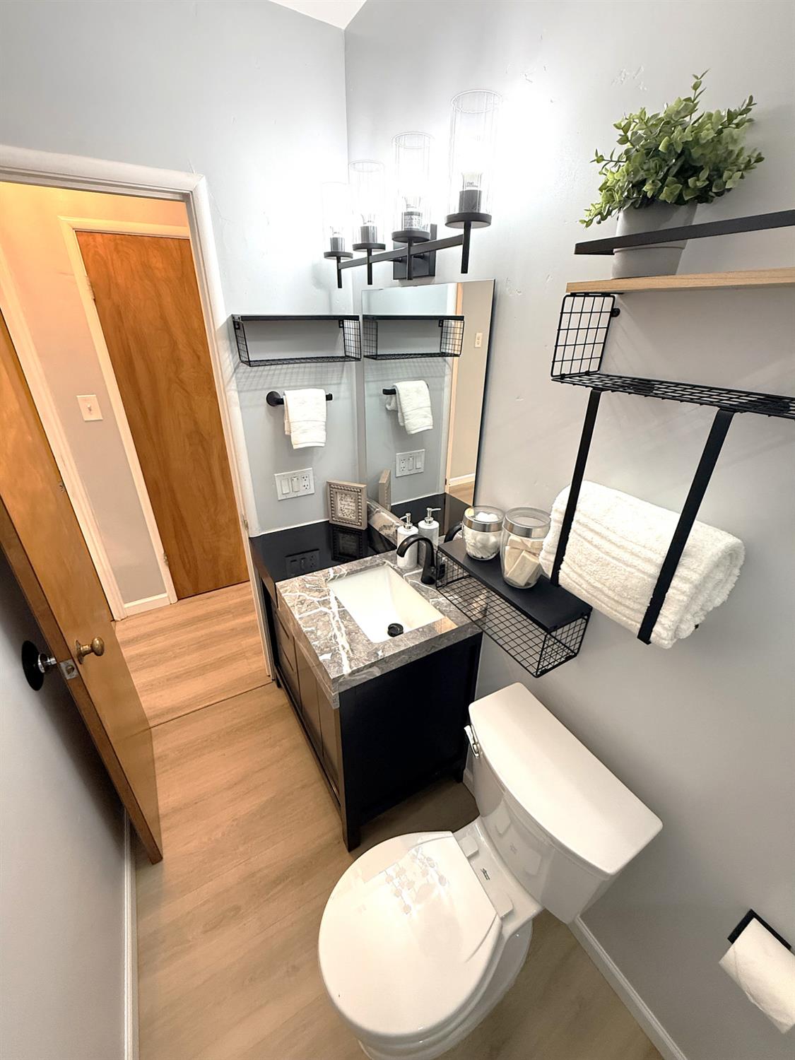 809 South Sowell Street Visalia, CA 93277 - Photo 44 of 58 a bathroom with a sink a mirror and toilet