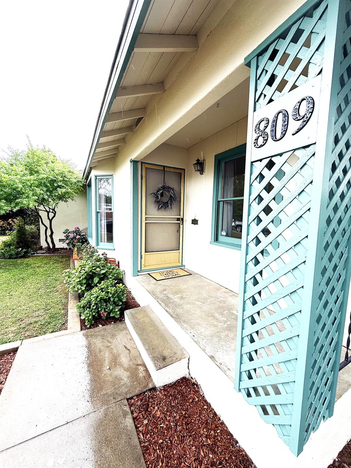 809 South Sowell Street Visalia, CA 93277 - Photo 6 of 58 a front view of a house with a garden