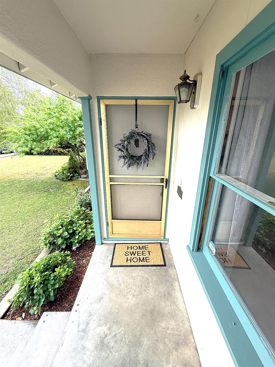 809 South Sowell Street Visalia, CA 93277 - Photo 7 of 58 a view of a porch with furniture and floor to ceiling window
