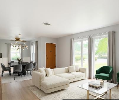 809 South Sowell Street Visalia, CA 93277 - Photo 10 of 58 a living room with furniture and large windows