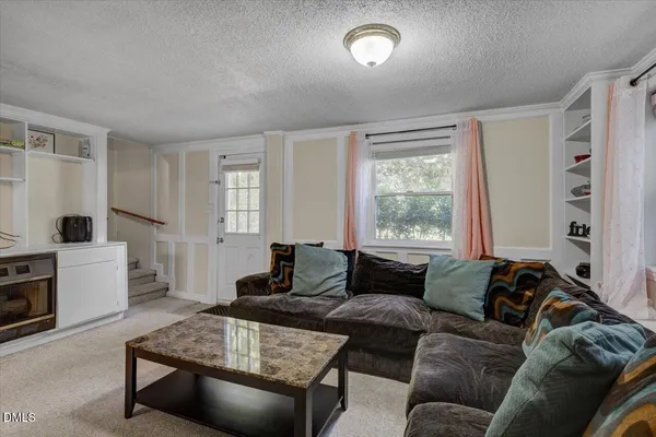 a living room with furniture and a window