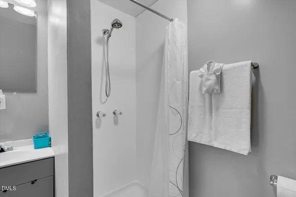 a bathroom with a shower and a tub