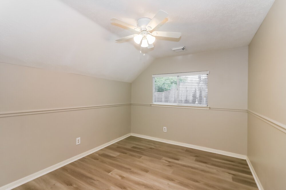 4635 Linden Place Pearland, TX 77584 - Photo 14 of 17 wooden floor in an empty room with a window